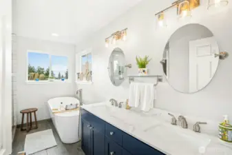 Five piece primary bathroom with soaker tub.