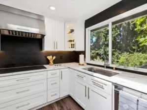 Gourmet kitchen features luxury Thermador appliances: double wall oven, 5-burner induction cooktop, refrigerator & dishwasher