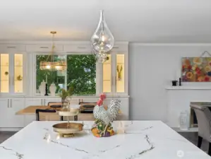 8'10" x 7'5" Cambria slab quartz kitchen & gorgeous pendant lights to enhance the natural light from the skylight