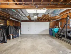 2 car garage with existing storage, & built-in Riccar vacuum