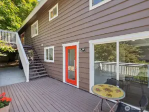 View from lower deck, showing where bedroom #6 exit comes out, the single red door enters right by laundry room, and the slider in lower right is the private exit from bedroom #4