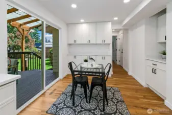 Casual dining area opens to covered deck