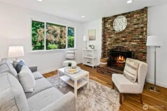 Family room is just off kitchen with cozy fireplace