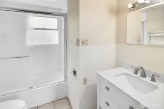 Full bathroom on the main floor serves all three bedrooms.