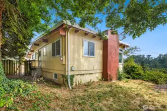 South view of the property - this corner lot has tons of space for your vision!