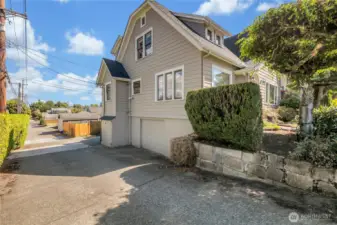 Side alley access to the garage, wood storage, and huge 10' X 30' covered under the deck storage area!