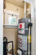 Primary closet with newer water heater