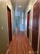 Hallway offset to keep shared social spaces separate from private personal spaces