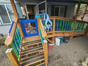 Stairs or ramp to the front door with a gate to provide for a fully fenced yard,