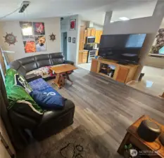 Living room with kitchen conveniently located just across the way.