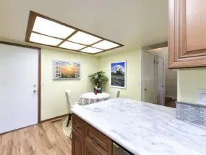 Tile accent backsplash.  Access door to garage.