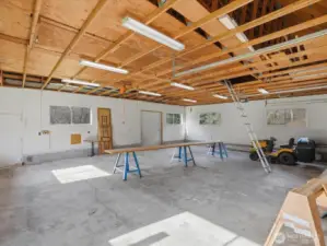 1200 sq ft barn/shop with concrete flooring, natural light, power, and an abundant storage above. Add a heater and you would have a versatile all year-round space.