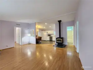 Wide angle view of the living room with wood stove