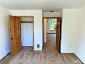 Dual solid core doors in bedroom looking out to Living room