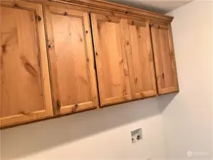 Upper cabinets above washer/dryer hookups in utility room