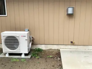 Ductless heat pump w/barbque hookup just right of edge, below fireplace vent