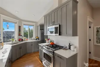 Kitchen with quartz counters, gas range, and great views!