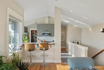 Vaulted ceilings carries throughout the upper level.