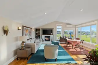 Welcoming living and dining room overlooking the Sound, territorial, and mountain views. Think of all those amazing sunsets you'll see!