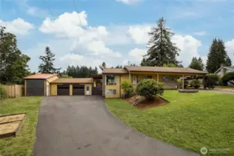 Welcome to this rambler with daylight basement and huge shop!