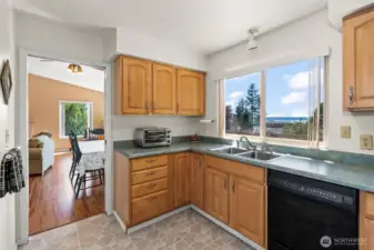 Kitchen Off Dining Area Soaks in Water Views