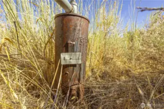 Well with Well Tag. Pump in well.