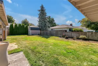 Fenced backyard for safe enjoyment by children, grandchildren, or pets.