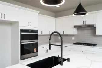 Photos are of a home in a different community and are for illustration purposes only to reflect typical finishes.  May depict seller enhancements.  Colors and options may vary.