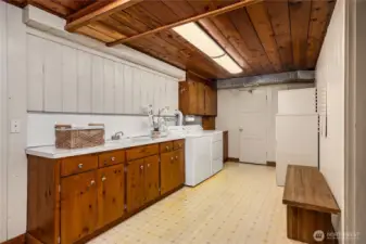 The laundry room is in the lower level.  Lots of storage cabinetry and a sink.