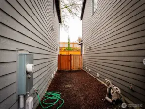 SIDE YARD WITH GATE TO BACKYARD...