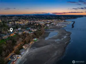 This majestic home overlooks the Puget Sound with pristine sunset views of Maury Island, Vashon Island, and the Olympic Mountains.