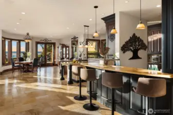 The inviting bar area has a Terrazzo countertop highlighted by handsome pendant lighting.