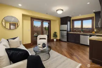 Guest suite/apartment is fully quipped living quarters with custom cabinetry, rear viewing deck and spectacular views of Mt. Rainier, English gardens, and Des Moines Marina.