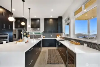 Chef’s kitchen with oversized island and lake views