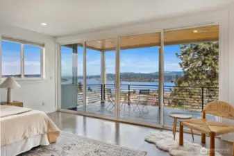 Large covered deck right off of the primary suite with floor to ceiling windows.