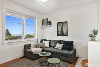 Private 2 bedroom ADU living area with large window and natural light