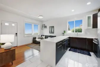 ADU kitchen with modern cabinetry and quartz counters