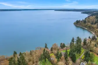 Perched above the Puget Sound this house has unobstructed views of the water and the mountain.