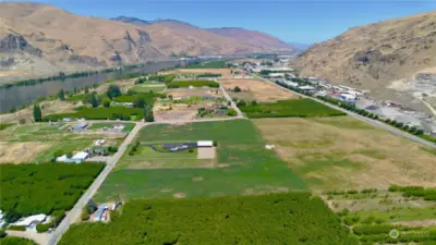 Eagle view from over the house looking up the Columbia River. For reference Rocky Race dam is in the distance.  Note the commercial zoned properties across the highway.  It is feasible the buyer may be able to acquire up zone zoning changes in the future