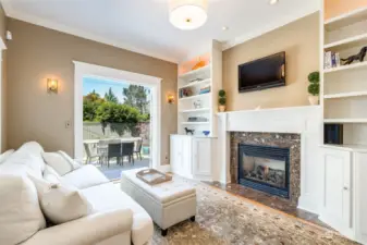 This family room off the kitchen was part of the addition, and adds so much value -- a casual place to hang out and entertain.  It opens via French doors to the deck and the back yard for BBQs and summer soirees.