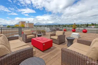 This rooftop seating area is on the west side and is centered around a fireplace.