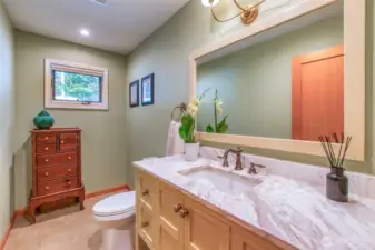 The guest bath on the mian floor just off the entry