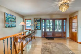 Entry to 192 Osprey. Stairs to left to the lower floor. Open concept is bright and welcoming