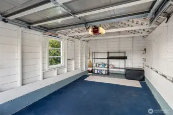 Detached garage interior on alley.