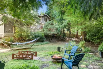 A BBQ area, and a cozy firepit spot, ideal for gatherings and relaxation