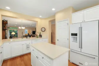 Kitchen bar opens to ding area