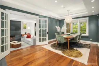Elegant dining room with continuation of walnut floors