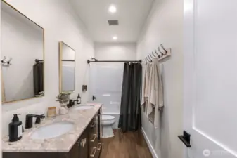 Down stairs full bathroom with dual sink vanity
