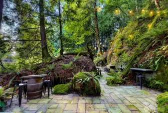 Monolith Chuckanut sandstone "Grotto" with tables and chairs, lighting and fire pits