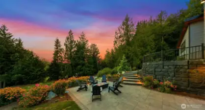 Front patio firepit next to AMAZING lighted water feature with two big falls